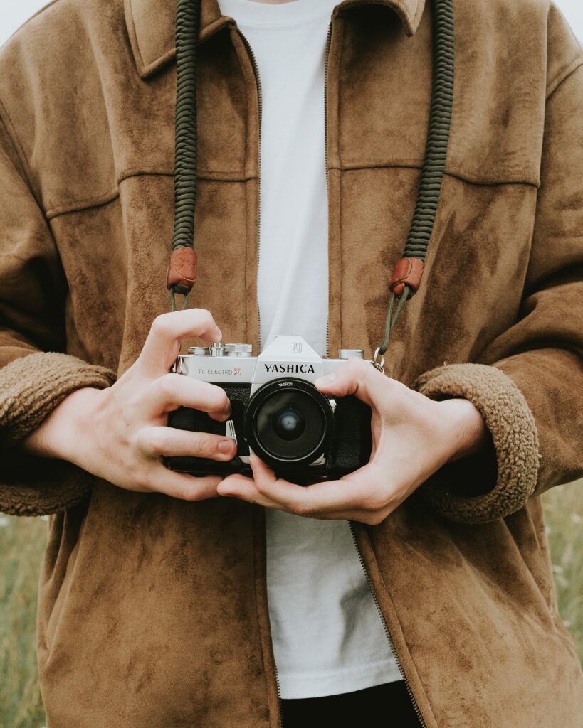a boy with a camera in his hand