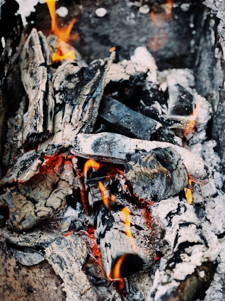 Hot burning barbecue(BBQ) coals with different shades of gray ashes