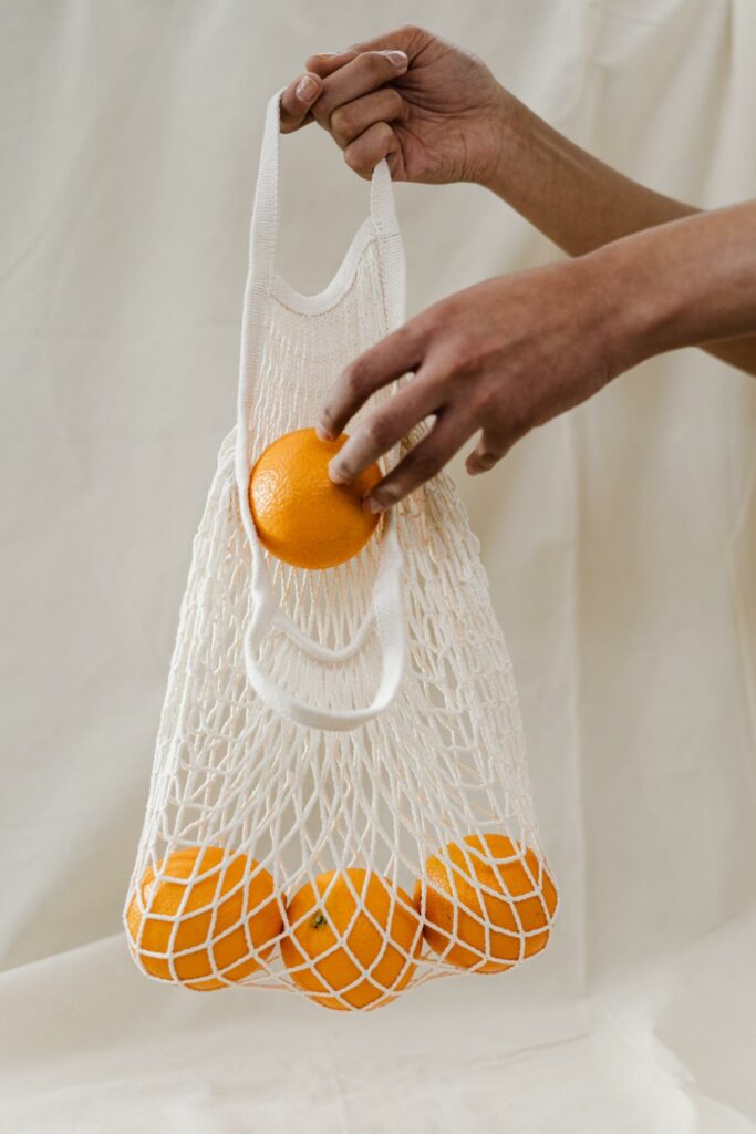 bag of oranges with white background