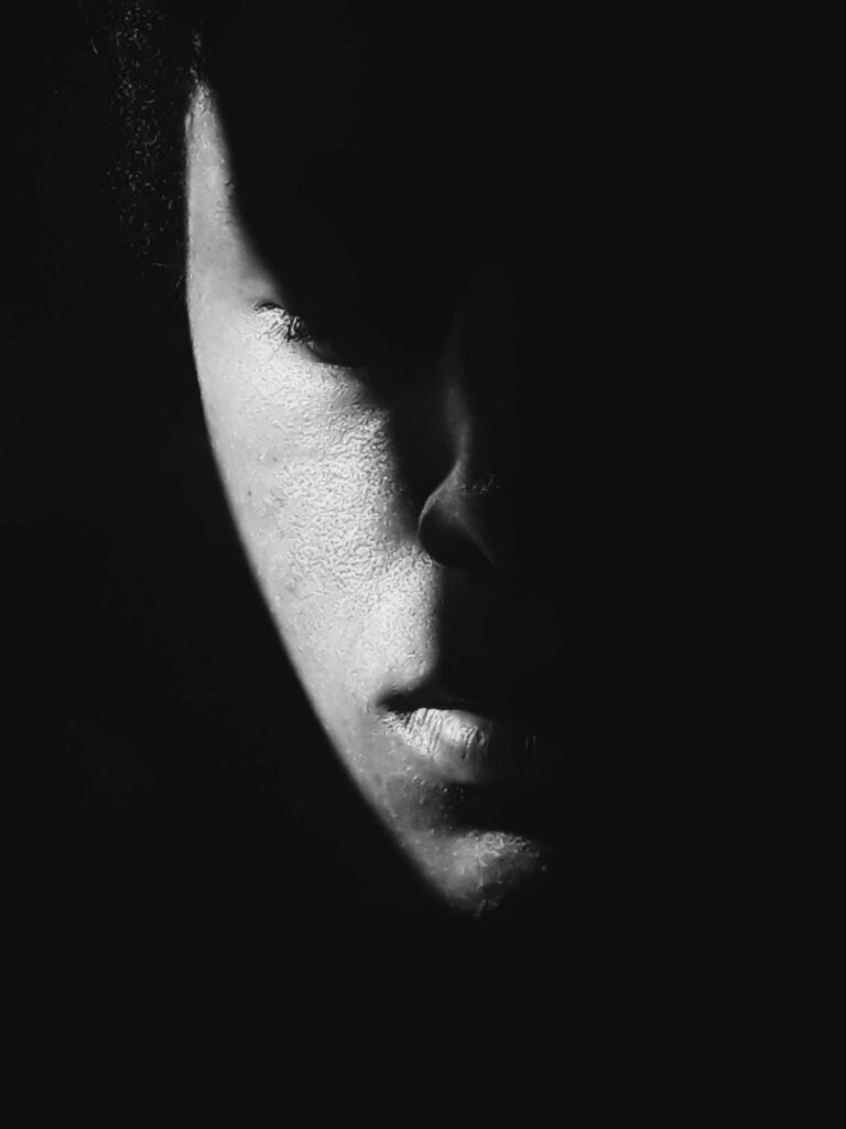 monochrome of the face hidden in the shadows