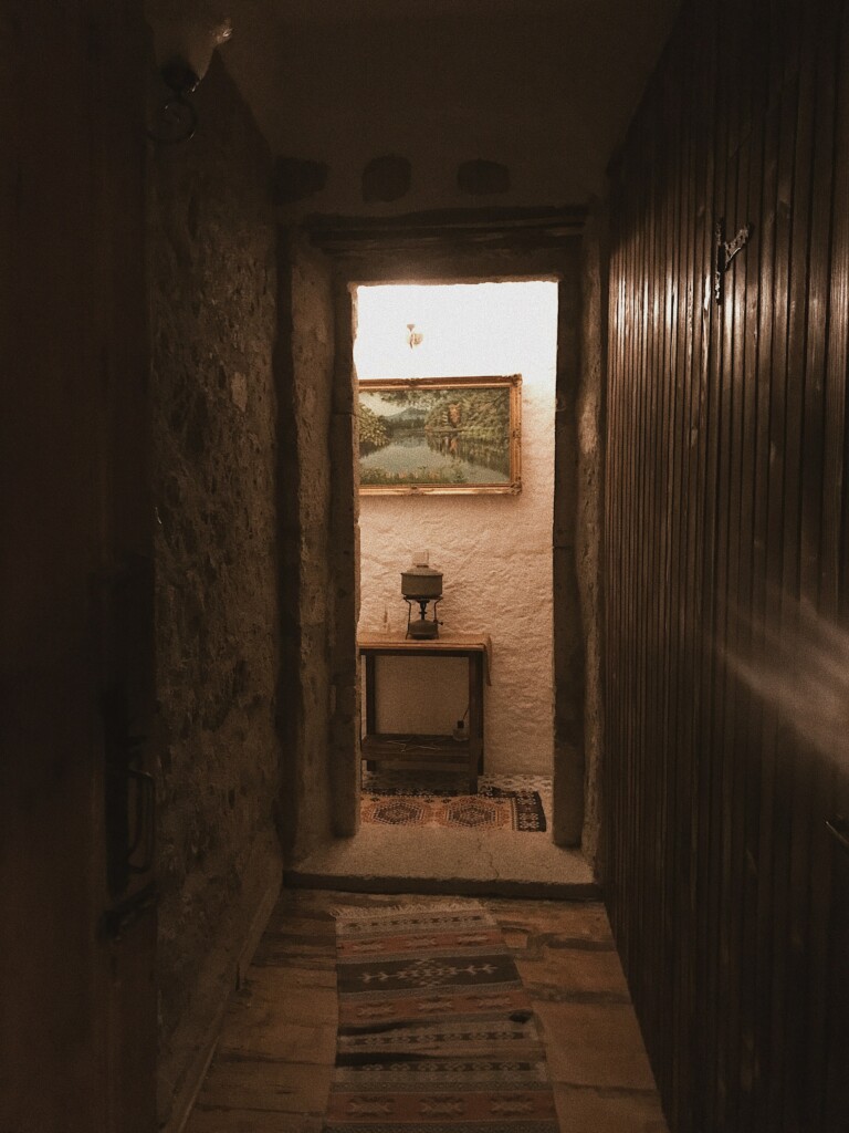 picture of the corridor of an old house with an old sign on its wall