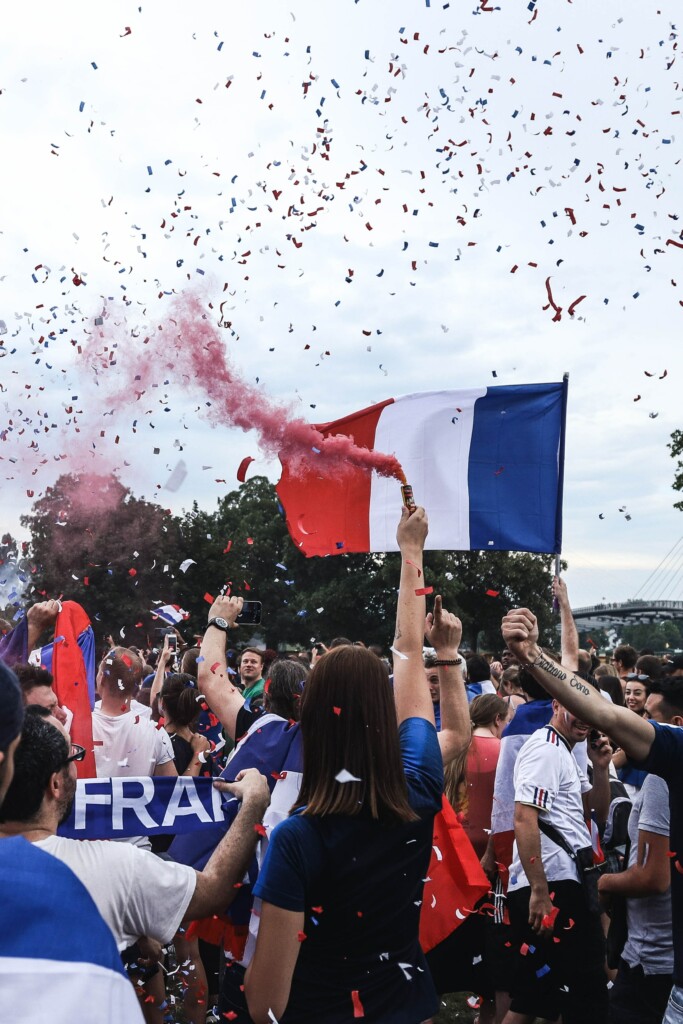 France people celebrating with France flag in their hands