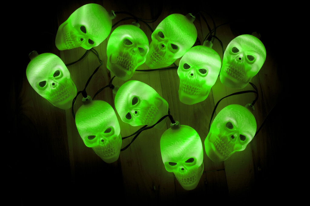 Cluster of glowing green scary skulls Halloween lights for Halloween Festival.