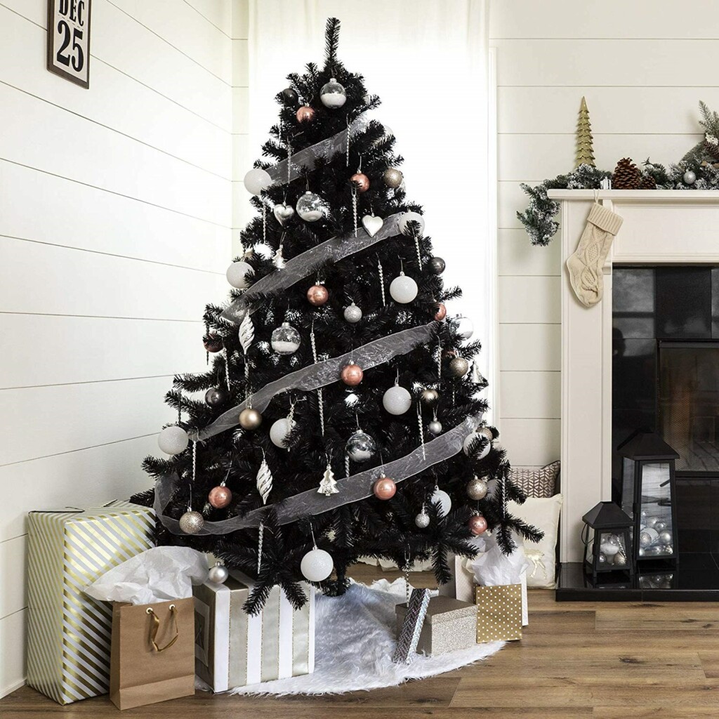 Black Christmas tree with white ribbon decorations and white and gold balls
