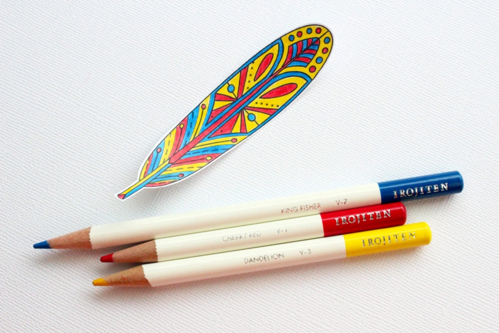 an image of a feather painted with a red, blue and yellow colored pencils