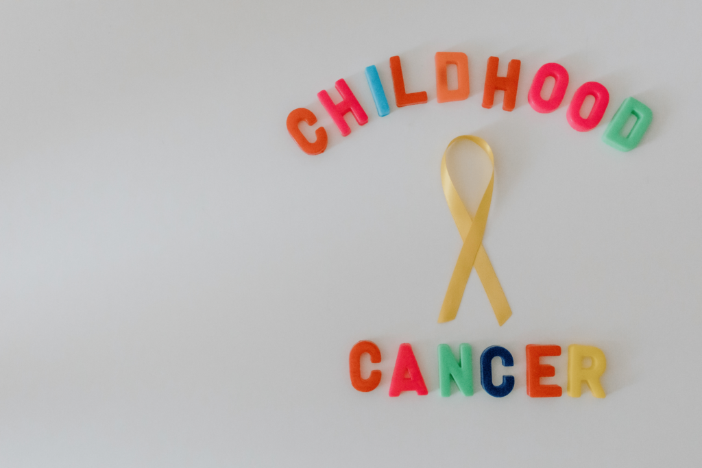 Childhood Cancer Awareness month with gold ribbon