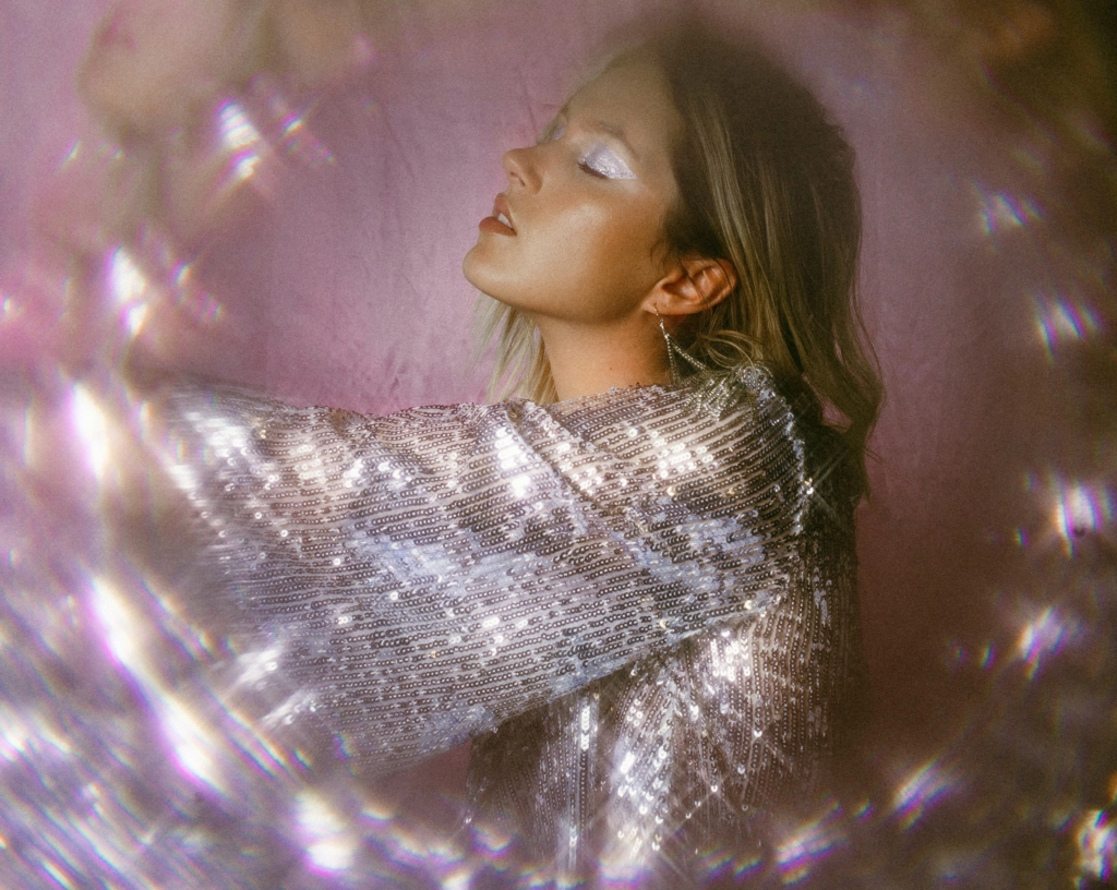 an image of a girl with silver lights around her